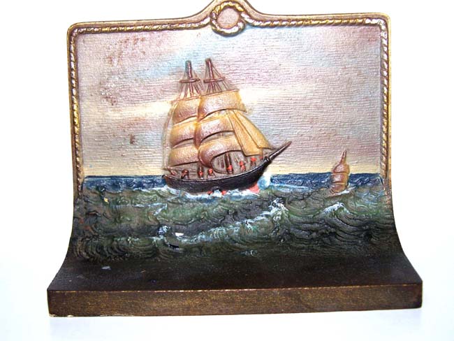 A fine pair of painted Antique Bookends by Bradley & Hubbard depicting a ship at sea
